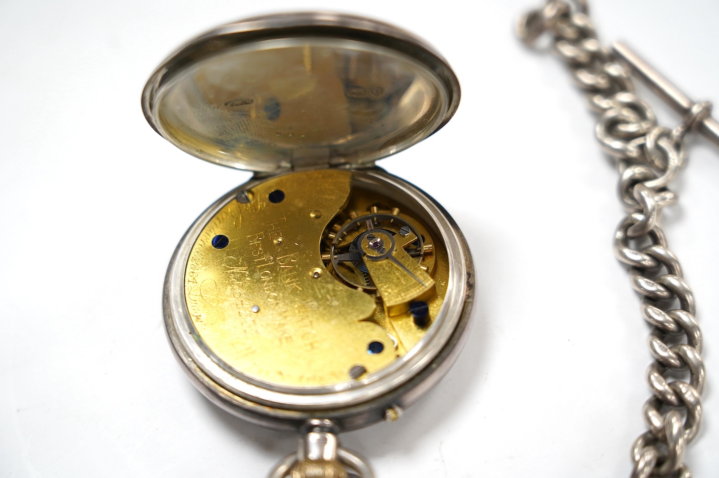 A late Victorian silver open face pocket watch, by J.W. Benson, with Roman dial and subsidiary seconds, together with a silver albert. Condition - poor to fair